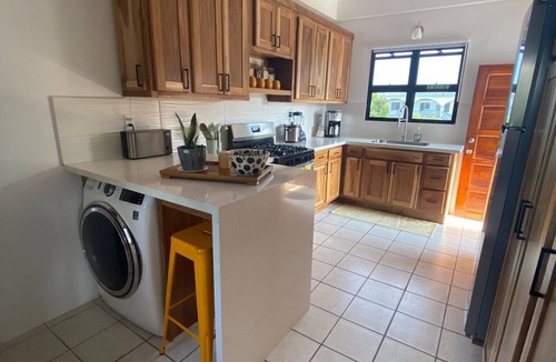 Dangriga Apartment | Downtown Dangriga! Style and comfort with a pool. Maya Mountains and sea views.