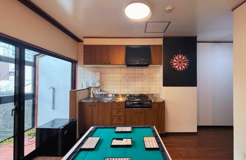 Takamatsu House | Downtown Takamatsu: Top floor of a building in the entertainment district where groups can party all night long. 168 square meters, entire building available for private rental. Mahjong, karaoke, darts, rooftop terrace. Accommodates up to 10 people.