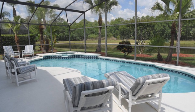 Delightful modern 4 bed, 3 bath villa with private pool/spa and lake view. in Kissimmee