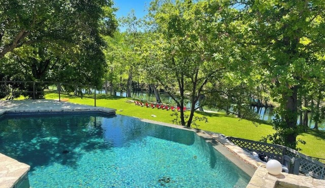 Inviting waterfront home with pool, patio, fireplace, W/D, & dog-friendly in Hunt