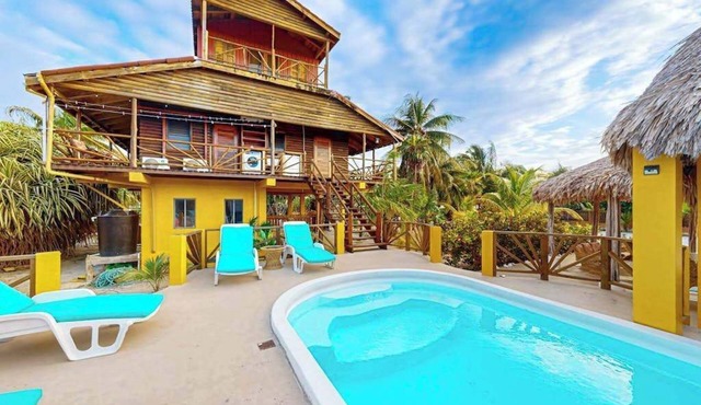 Waterfront villa with private pool, balcony, partial AC, fast WiFi - near beach in San Pedro