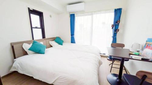 One-Bedroom Apartment with Balcony and City View