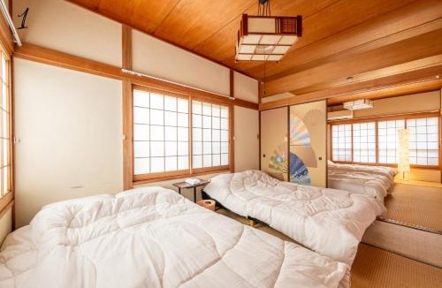 Shin-Osaka Apartment | 7BR Entire 2-House Rental Sleeps 12 Theater and Games Umeda 3 Min