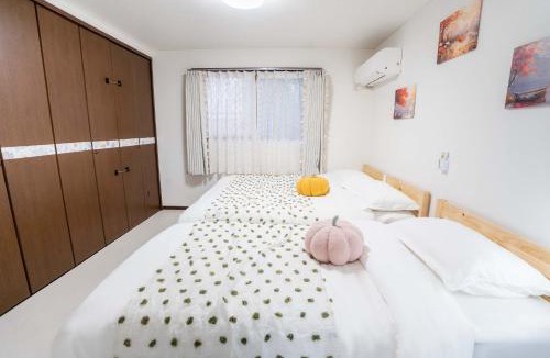 Nishikoiwa Apartment | 102Room,Free parking just a 7-minute walk from Koiwa tram stop This spacious 75-square-meter flats features two large bedrooms and can accommodate up to seven guests